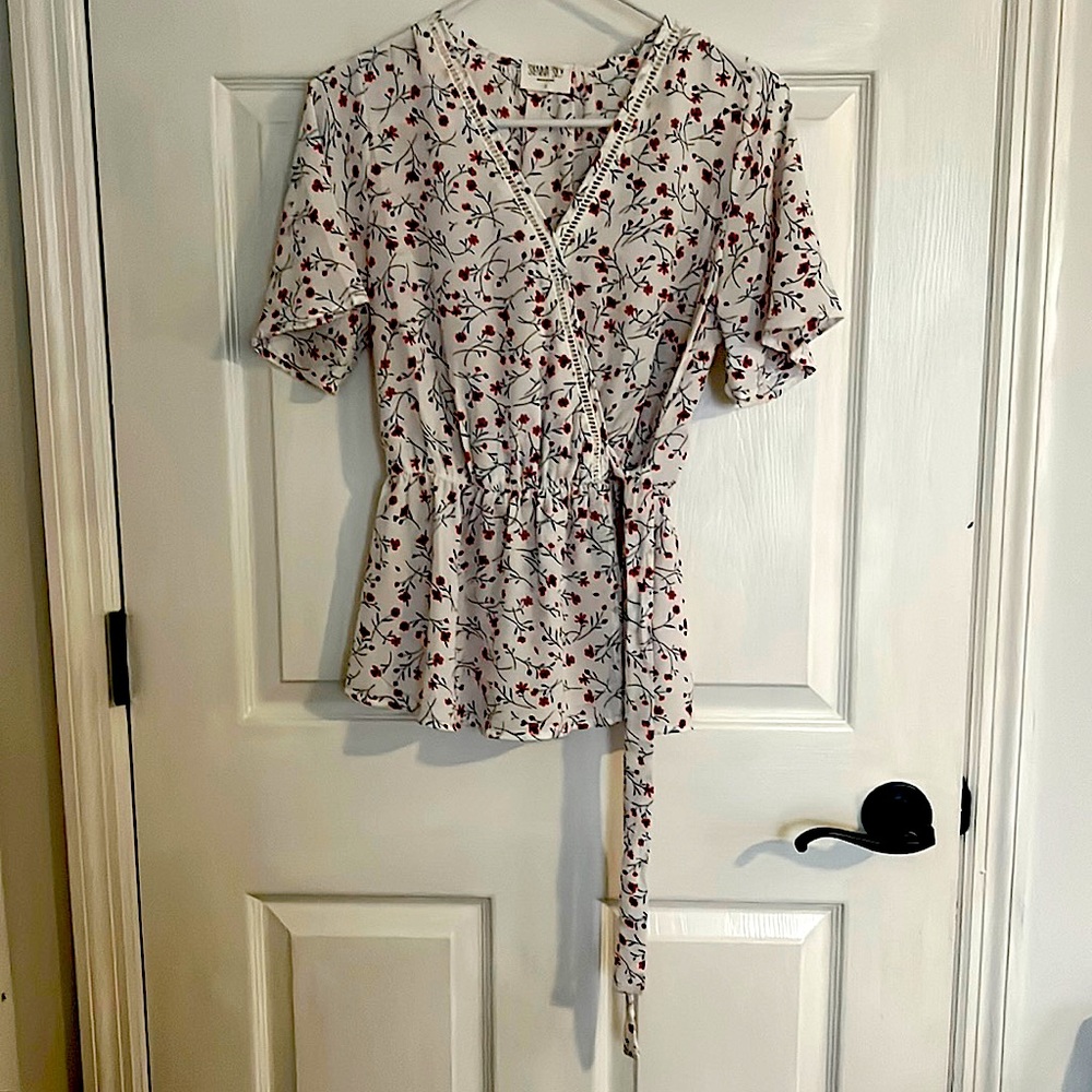 Fancy shirt with tie on left side of hip